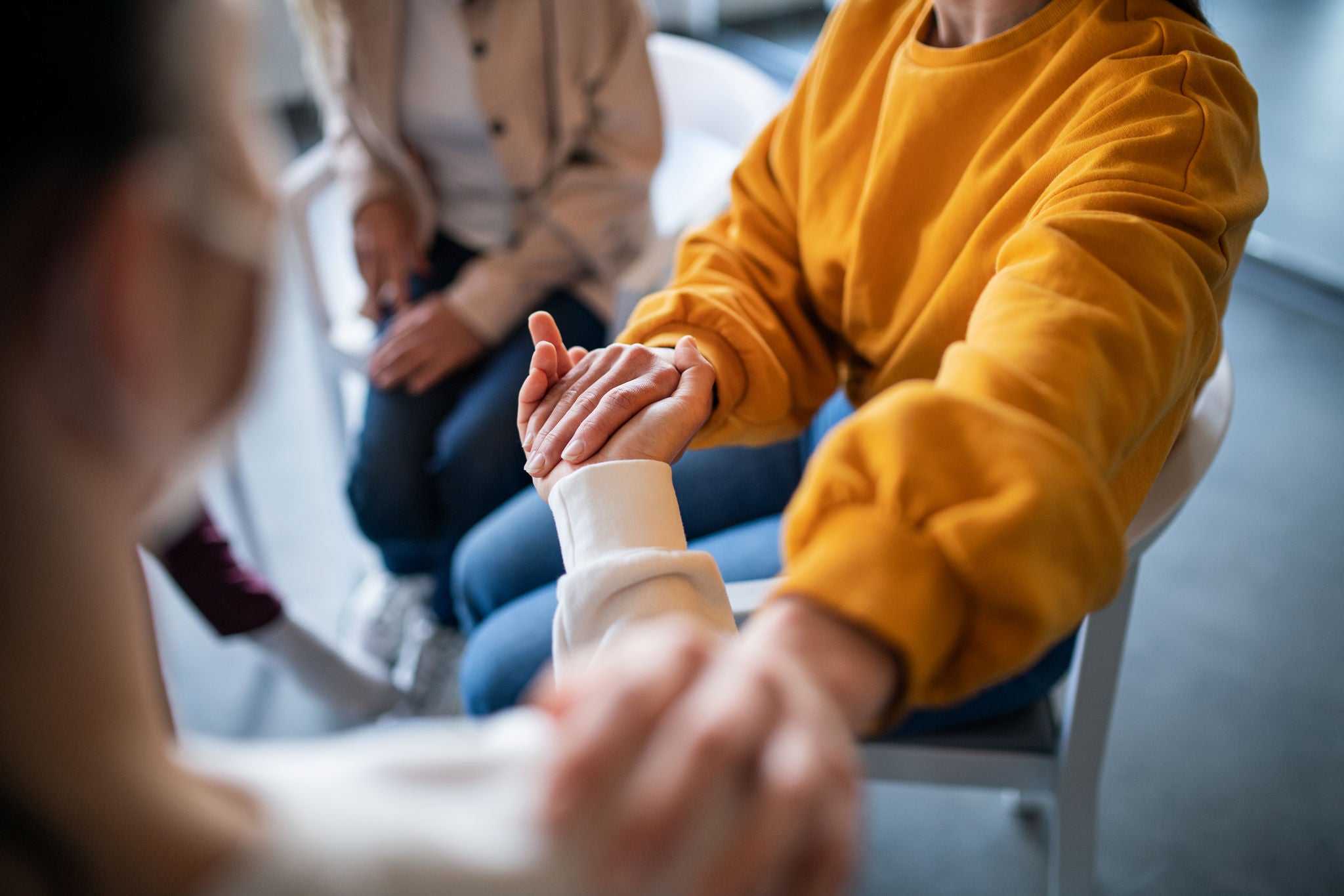 1321111818 People supporting one another on grief therapy session.