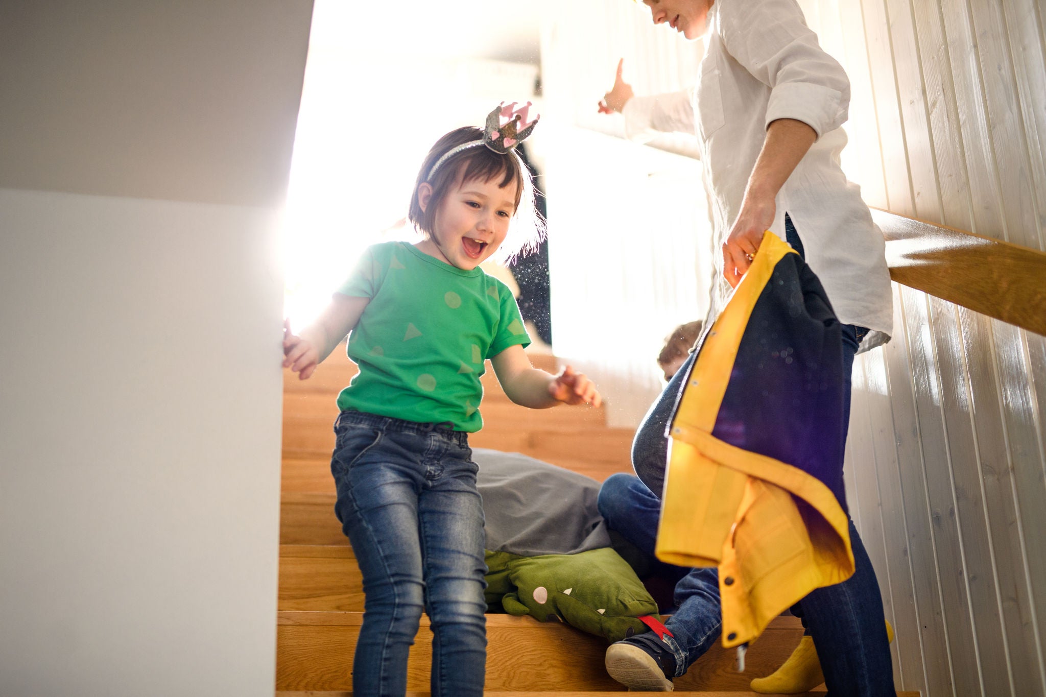 Children getting dressed for school, morning stress concept.