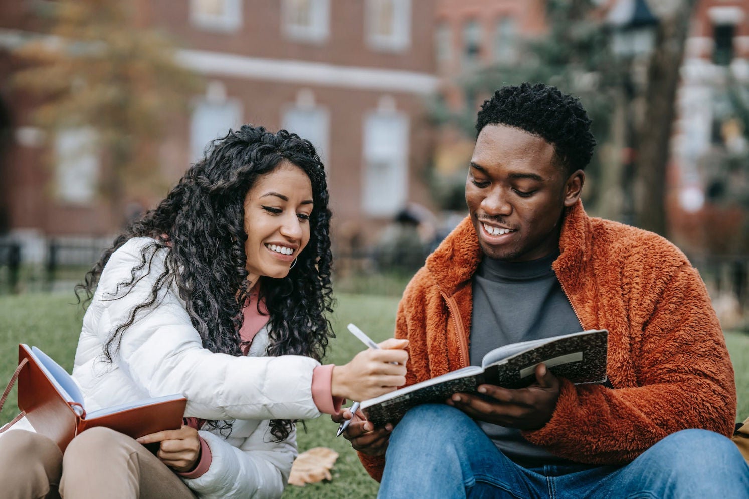 Students writing outdoors