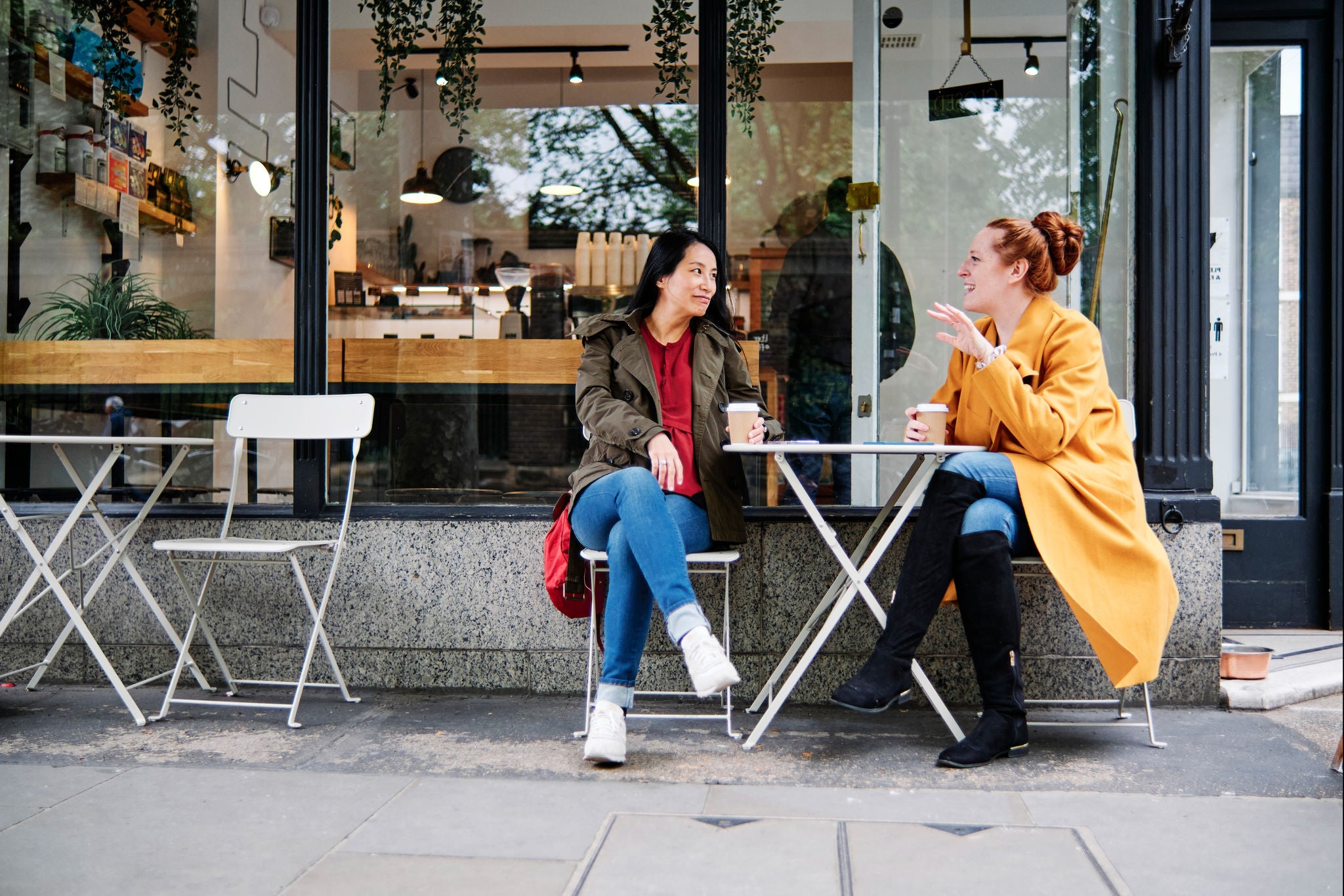 Friends hanging out and having a good time in a cafe. London, Engalnd.