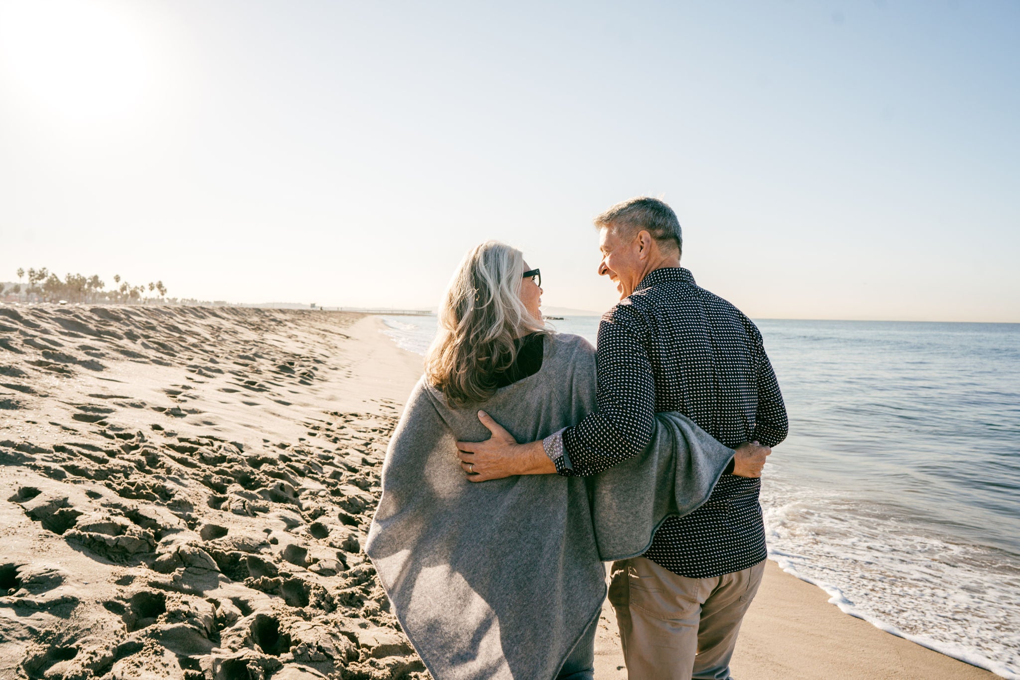 Active seniors walking on the beach